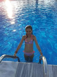 Full length portrait of woman in swimming pool