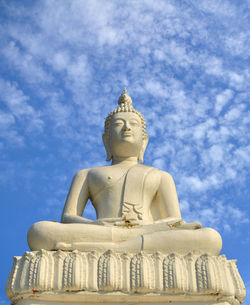 Low angle view of statue against blue sky