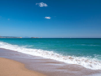 Scenic view of sea against blue sky