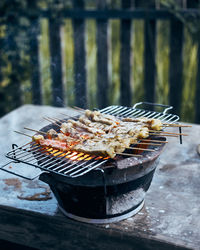 Close-up of meat on barbecue grill