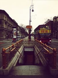 Railroad station in city against sky