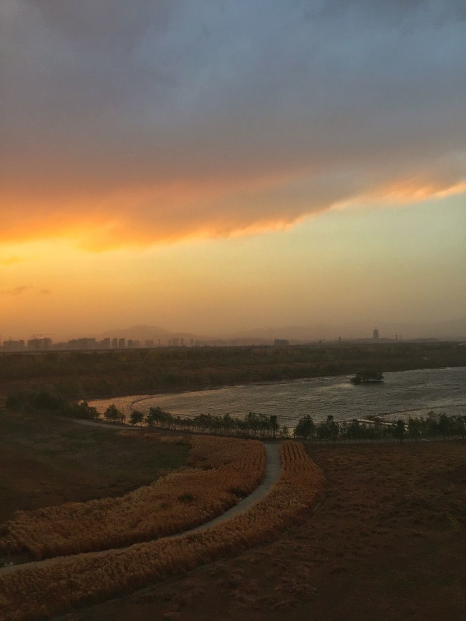 SCENIC VIEW OF LAND AGAINST SKY DURING SUNSET