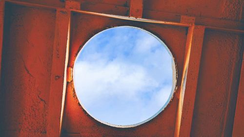 Low angle view of sky seen through window