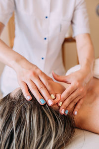 Cosmetologist does facial massage for woman. beauty skin care