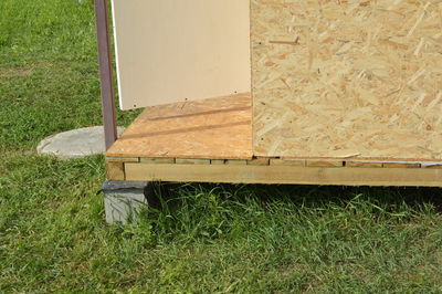 High angle view of wooden post on field