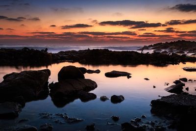 Scenic view of rock formation at sunset