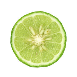 Close-up of lemon slice against white background