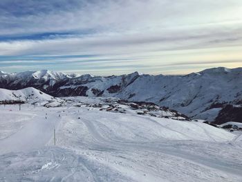 Scenic view of snow covered mountains against sky