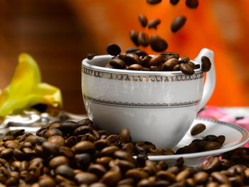 Close-up of coffee beans on table