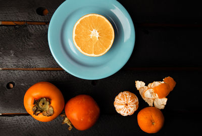 High angle view of orange fruit on table