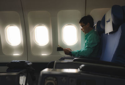 Man sitting in airplane