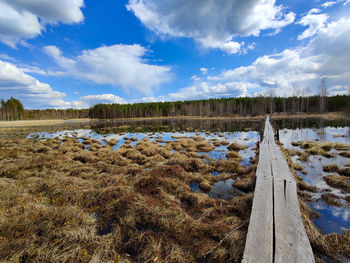 Panoramic view of field against sky