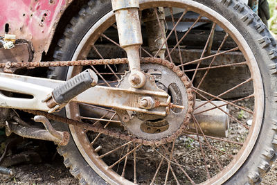 Close-up of rusty wheel in abandoned vehicle