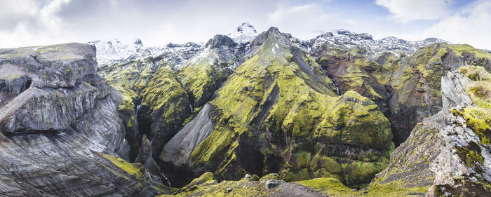 Panoramic view of rocky mountains against sky