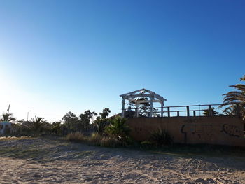 View of built structure against clear blue sky