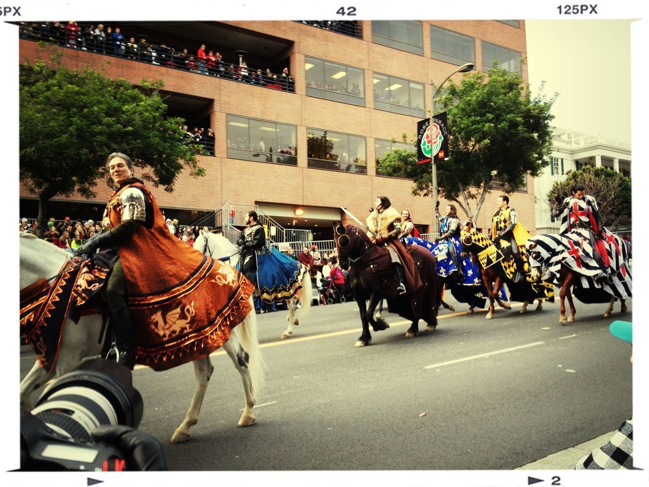 horse, building exterior, architecture, men, street, built structure, transportation, land vehicle, city, mode of transport, auto post production filter, large group of people, transfer print, road, working animal, person, outdoors, bicycle, motorcycle