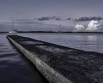 Sailboat in sea against sky