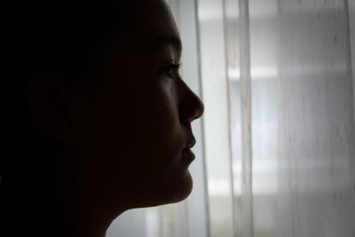 Portrait of young indonesian girl looking away