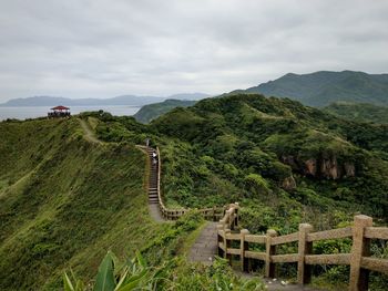 Scenic view of mountain against cloudy sky