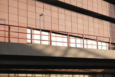 Low angle view of footbridge by building