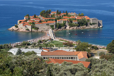 High angle view of townscape by sea