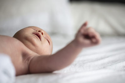 Close-up of woman sleeping on bed