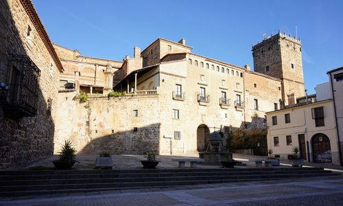 View of buildings in town against sky