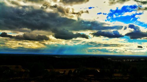 Scenic view of landscape against cloudy sky