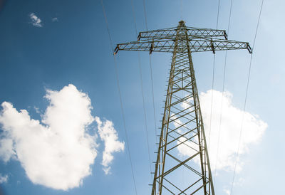 Low angle view of electricity pylon against sky