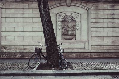 Bicycle against brick wall