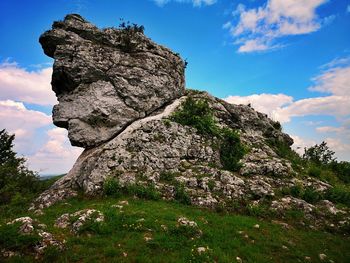 Low angle view of rock formations against sky