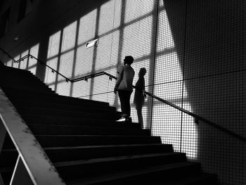 Low angle view of woman standing on staircase at tokyo big sight