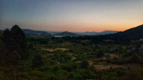 Scenic view of landscape against sky during sunset