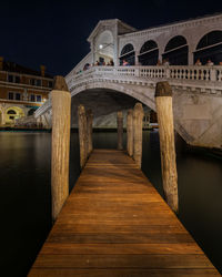 Bridge over river at night