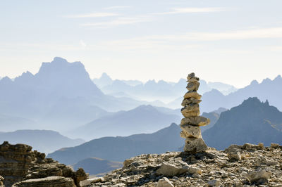 Scenic view of mountains against cloudy sky