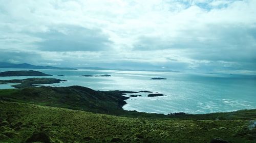 Scenic view of sea against cloudy sky