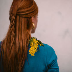 Rear view of a woman with red hair 