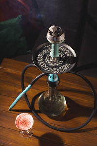 High angle view of hookah on table at home
