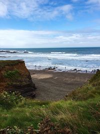 Scenic view of sea against cloudy sky