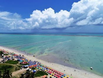 High angle view of people on beach against sky