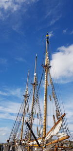 Low angle view of sailboat in sea against sky