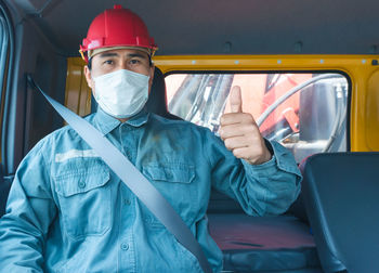 Portrait of man working in bus