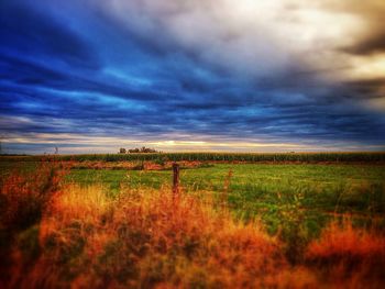 Scenic view of landscape against cloudy sky