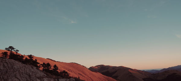 Scenic view of mountains against sky during sunset