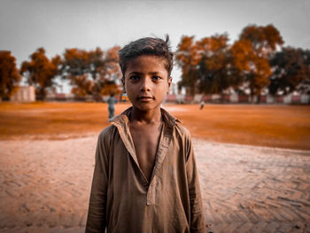 Portrait of young man standing outdoors