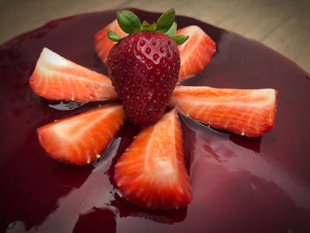 High angle view of chopped fruits in plate on table