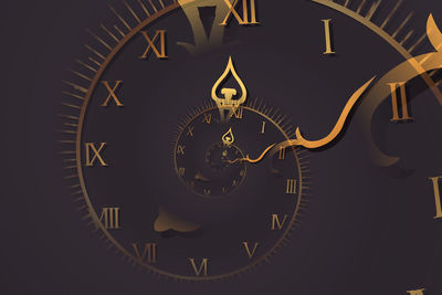 Close-up of clock against black background