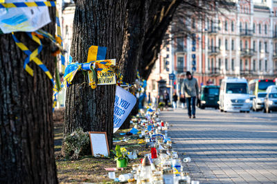 Flowers, candles and posters in support of ukraine in front of the embassy of ukraine in riga