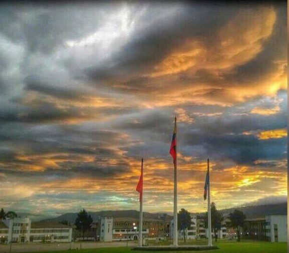 cloud - sky, sky, architecture, building exterior, built structure, dramatic sky, nature, flag, no people, city, sunset, environment, storm, outdoors, industry, storm cloud, beauty in nature, dusk, tower, wind, pollution