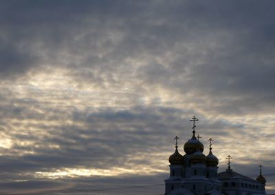 Low angle view of church and building against sky